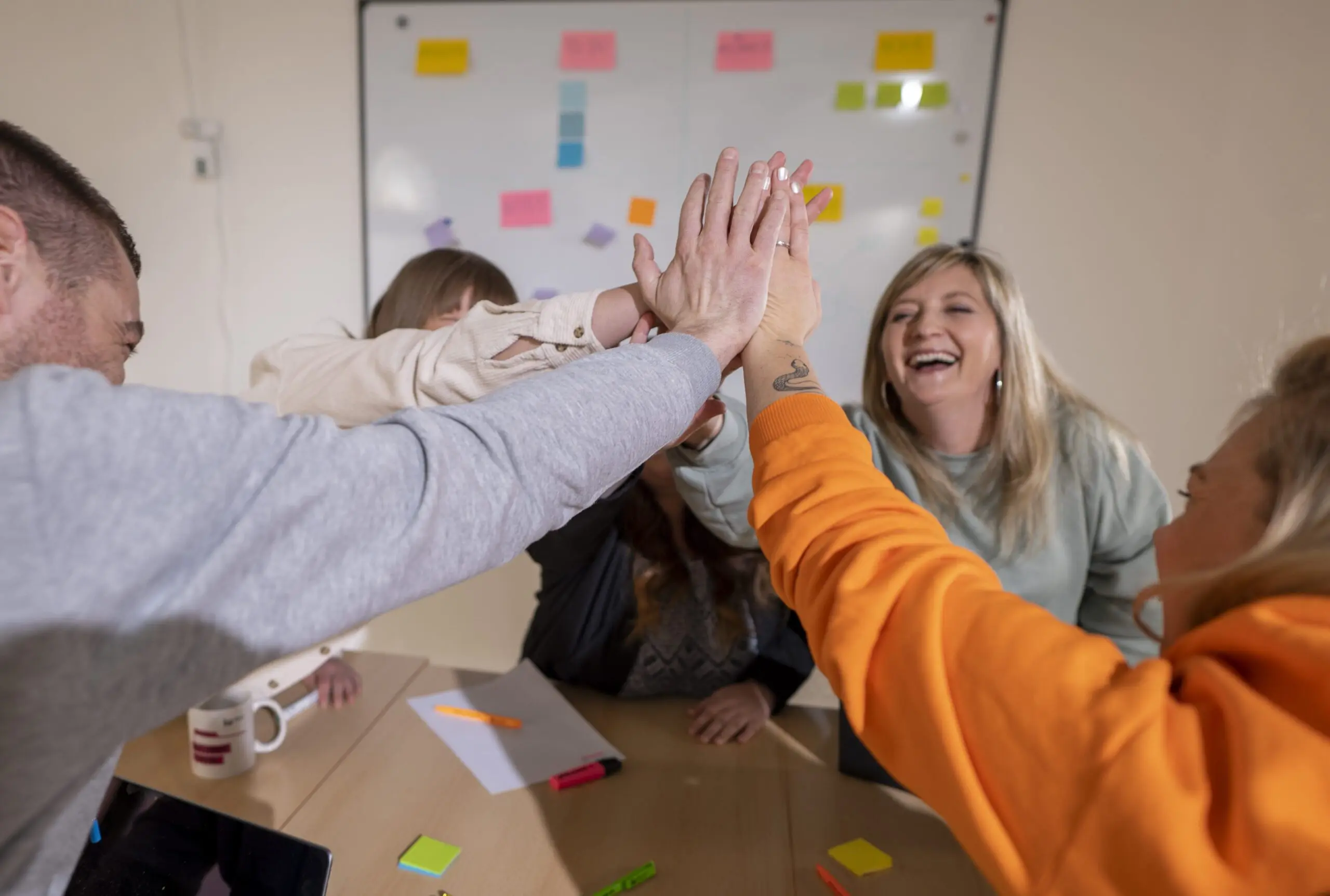 High-five team Bad Reichenhall smiling people