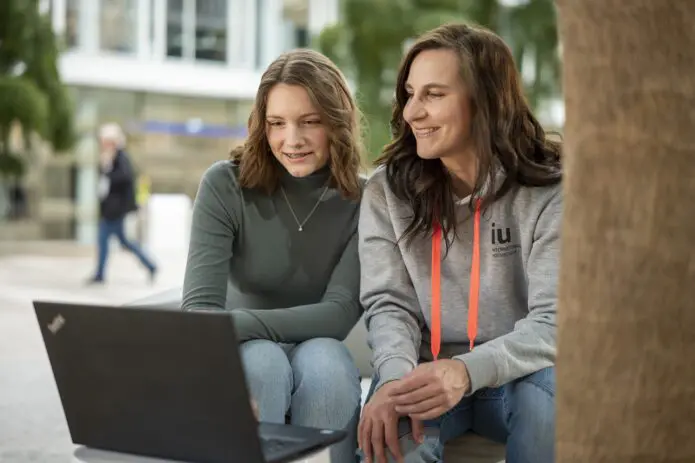 Woman from Study Advisory team with young student